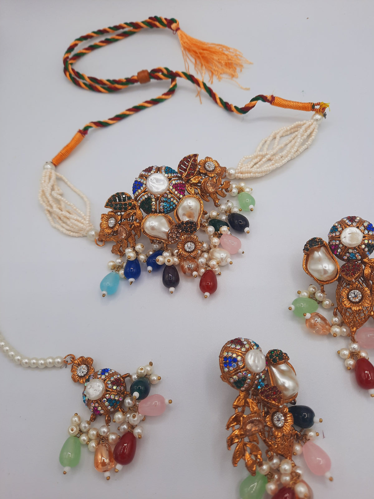 Turkish-style multi-color stone and pearl choker set with matching earrings and a maang tikka.
