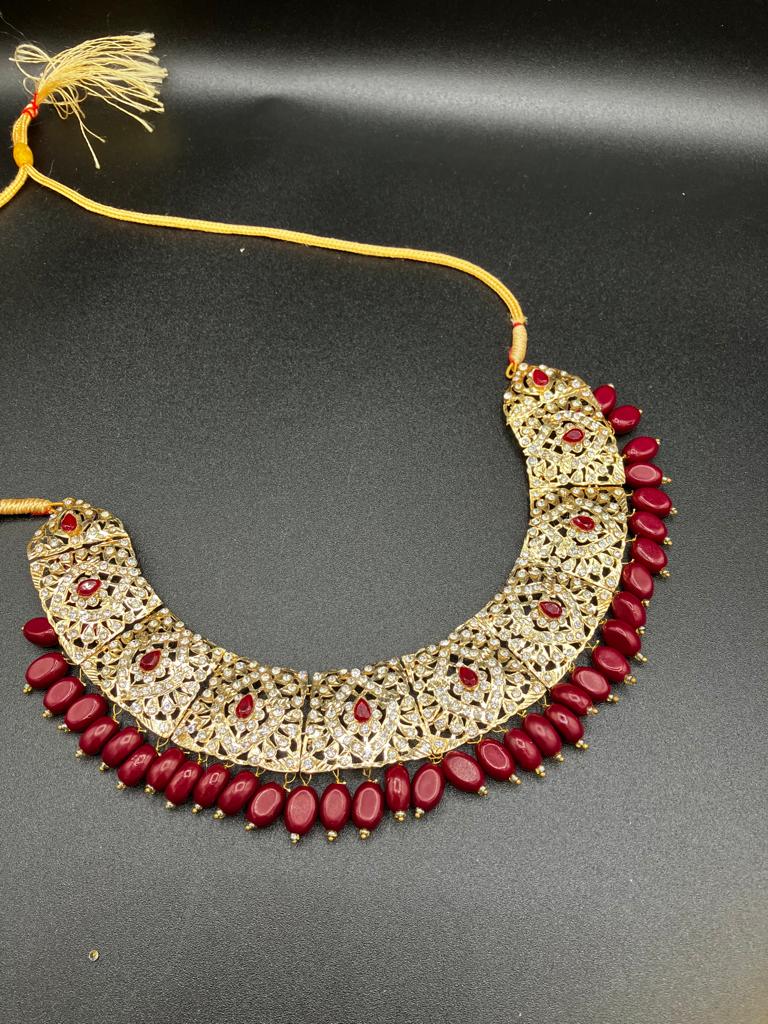 KUNDAN RED PEARLS & STONES GOLD-BASED EARRINGS WITH KUNDAN WORK CHOKER HYDERABADI STYLE JEWELRY SET - NATASHAHS